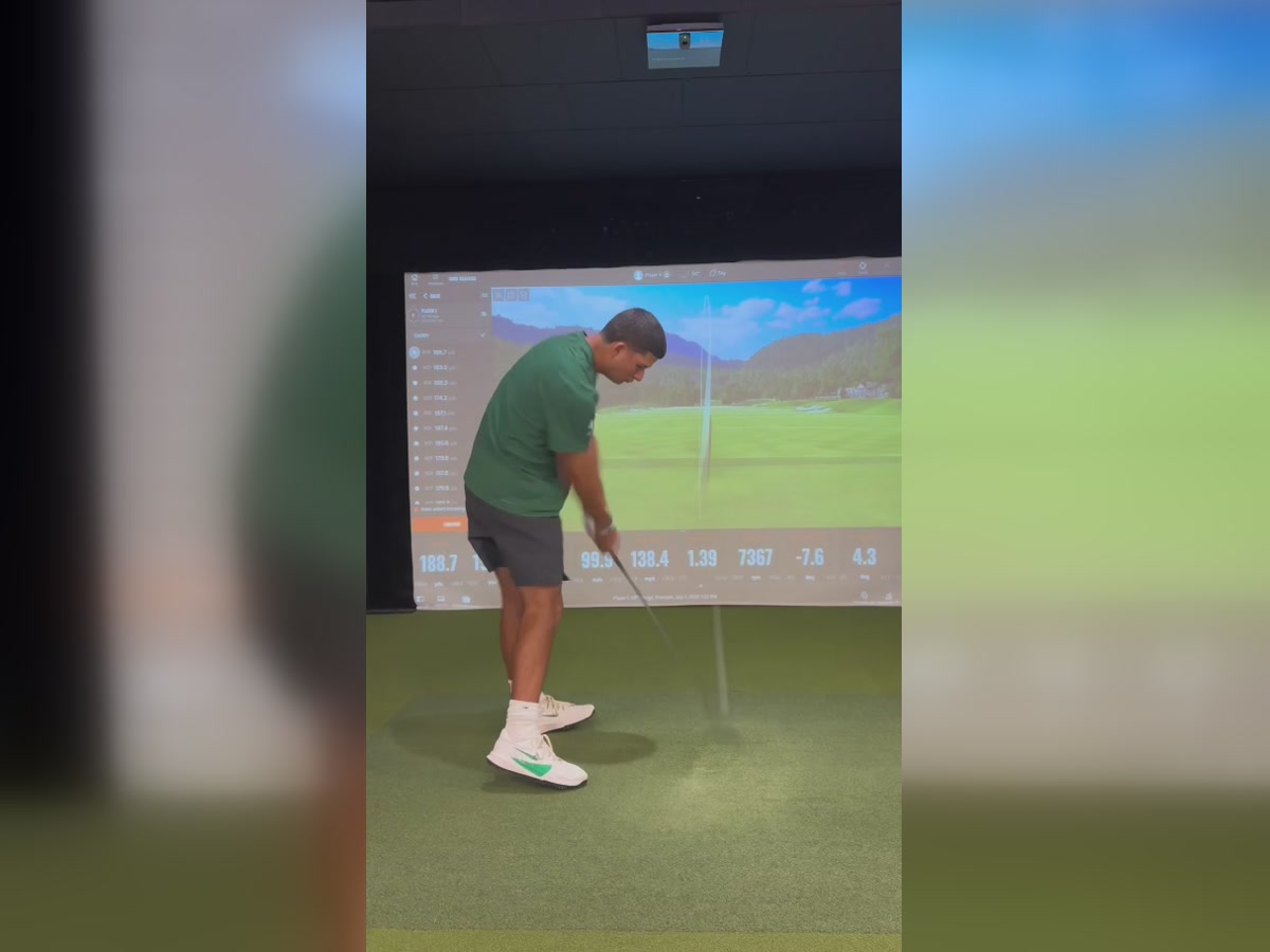 Cameron testing Ferro irons in the TrackMan bay at Clubhouse Hawaii